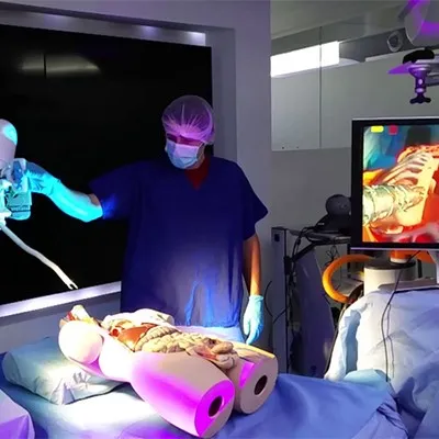 a person in a hospital room with a neon light