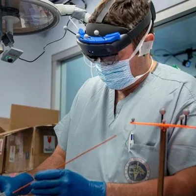 a man wearing a surgical mask and gloves