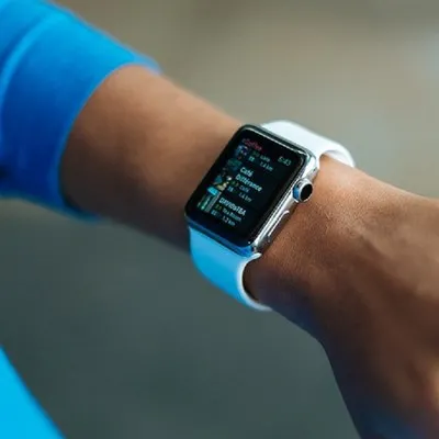 a close up of a person wearing an apple watch