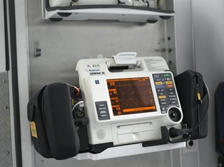 A medical device mounted on a wall, providing essential healthcare support