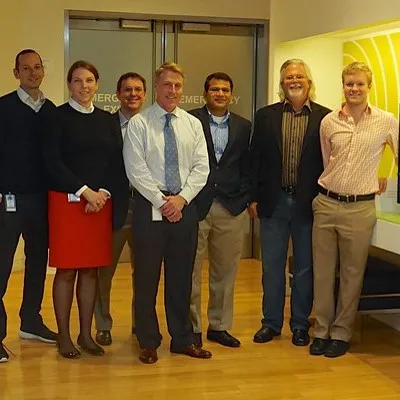 a group of people standing next to each other