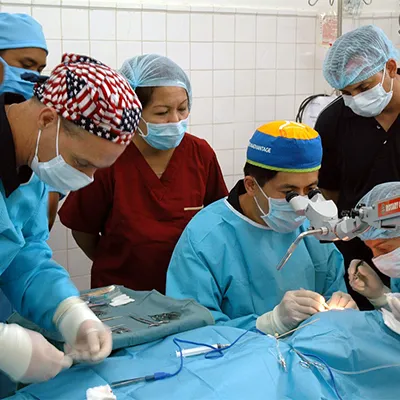 a group of doctors performing surgery in a hospital