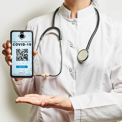 A doctor using a smartphone with a COVID-19 app to stay updated on the latest information and guidelines.