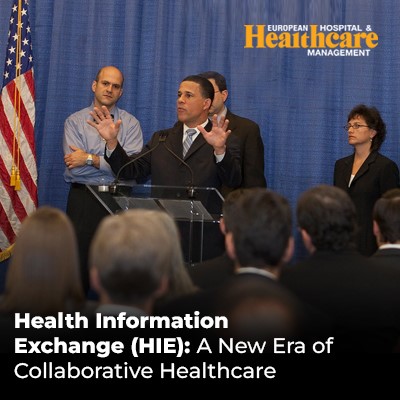 a group of people standing around a podium sharing of patient data among healthcare providers