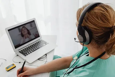 Healthcare professionals using electronic health records and digital systems to optimize patient care