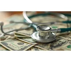 Healthcare economics concept with financial charts and stethoscope